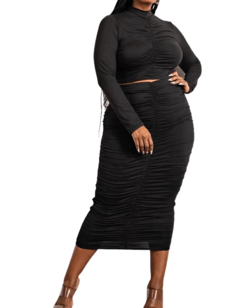 Front of a model wearing a size 2X Two Piece Long Sleeve Ruched Top And Skirt Set In Black in Black by The Curve. | dia_product_style_image_id:357103